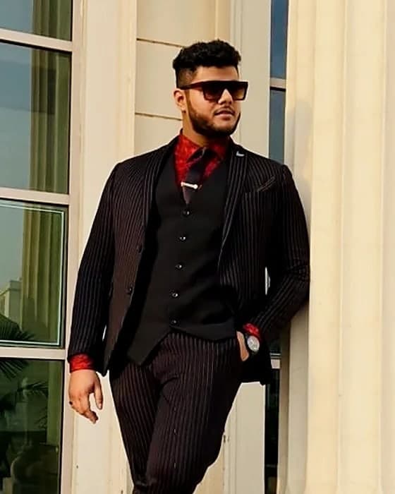 Amritash Chowdhry, founder of Mind Align, in a pinstripe suit